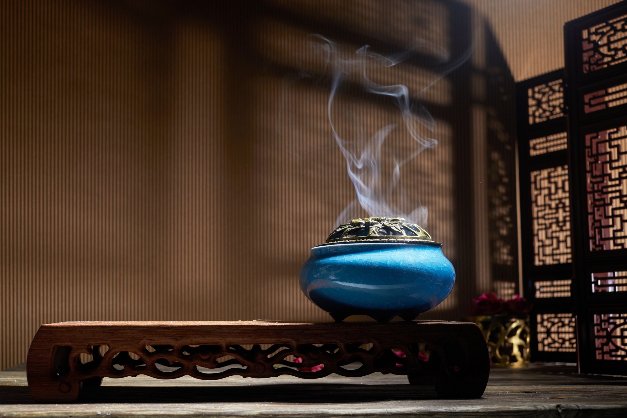 Smoke from Burning Incense Sticks Standing on Lotus Incense Holder